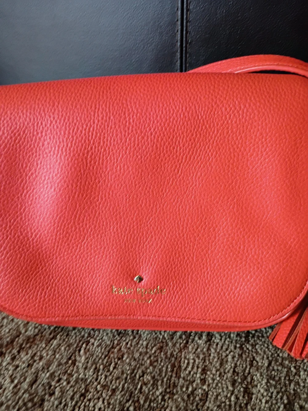 kate spade coral pebbled leather crossbody with tassel